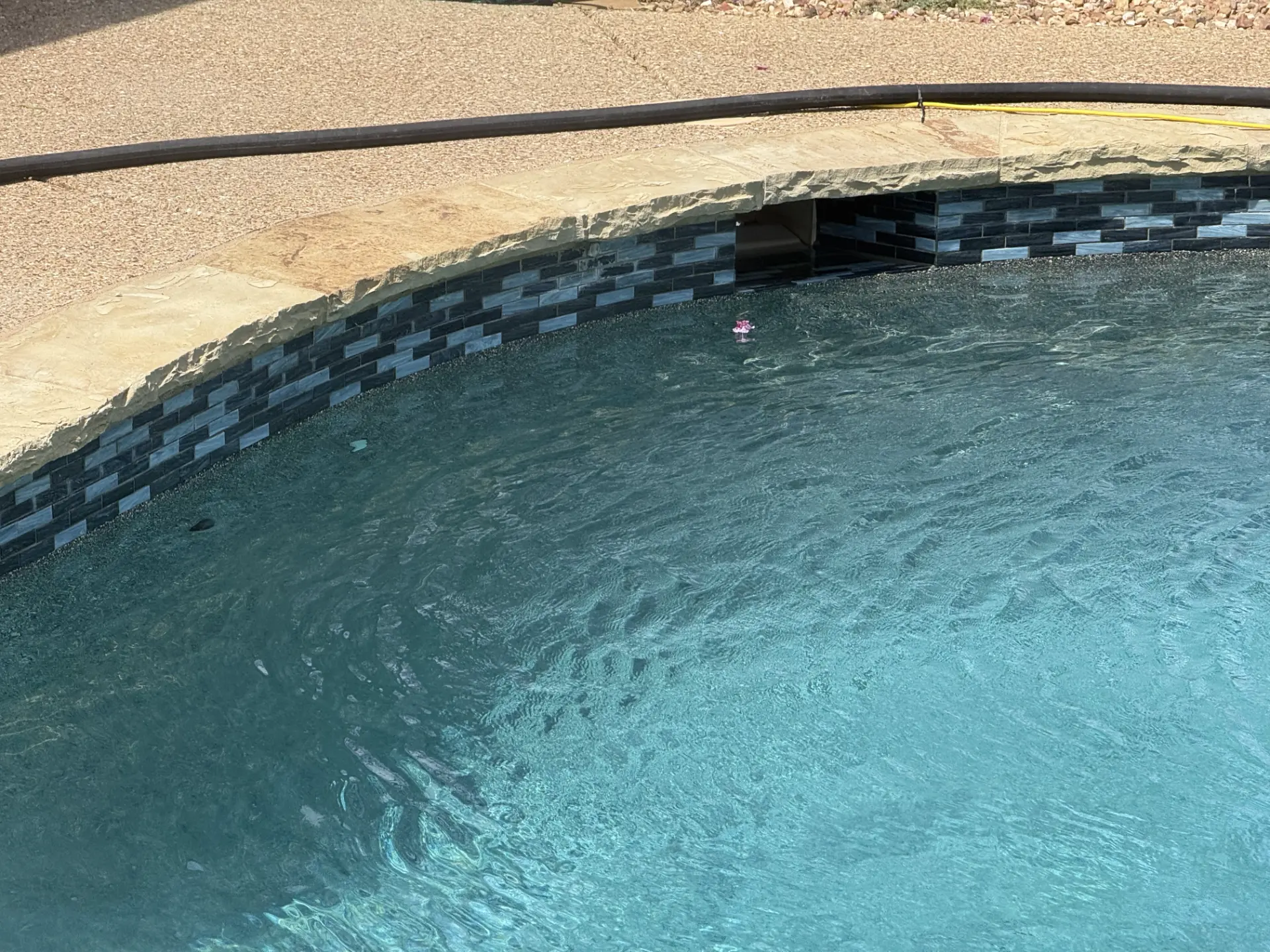 Clean pool coping and tile line after scale removal